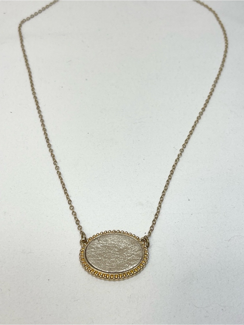 Gold Oval Pendant Necklace with Textured Center